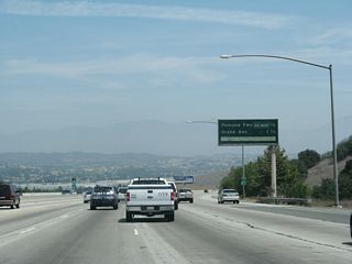 This mileage sign along California 57 (Orange Freeway) north provides the distance to Exit 16, California 60 (Pomona Freeway) west and Exit 24B, Grand Avenue. This sign still shows California 60 as the "Pomona Freeway." Even though several signs that include the freeway name been removed, replaced, or covered, many still remain in use, especially in Los Angeles County.
