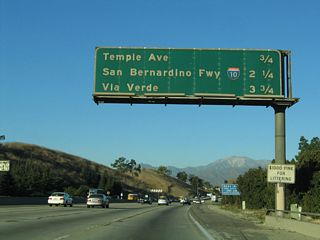 The next three exits along northbound are Exit 20, Temple Avenue; Exit 21, Interstate 10 (San Bernardino Freeway); and Exit 22, Via Verde/Raging Waters.