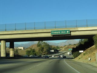 Northbound California 57 (Orange Freeway) meets Exit 20, Temple Avenue. Use Temple Avenue east to Diamond Bar and west to Spadra, with connections to Holt Avenue/Valley Boulevard. There is no interchange between California 57 and Holt Avenue.