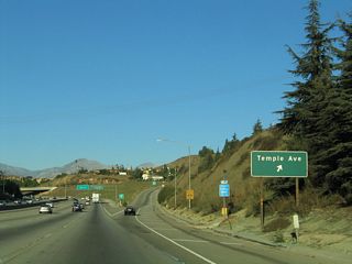 Due to limited sight distance between the last sign and the off-ramp, a roadside sign for Exit 20 is also posted.