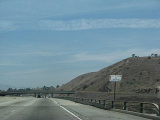 A white bridge identification sign still refers to this interchange as the joining of Routes 10, 57, and 210. This sign could be changed to reflects only Routes 10 and 57, since 210 does not terminate here (since 2002).