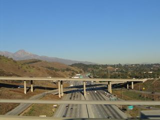 This view looks from the California 57 overpass east toward Pomona on Interstate 10, which rides the floor of the valley and is well below the grade of California 57.