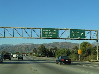 Northbound California 57 (Orange Freeway) reaches Exit 24A, Covina Boulevard; the following exit is Exit 24B, Arrow Highway.