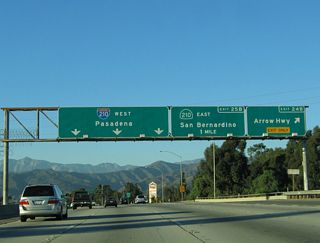 Northbound California 57 (Orange Freeway) reaches Exit 24B, Arrow Highway into downtown San Dimas. The next two exits are for the Foothill Freeway east (California 210) and west (Interstate 210).