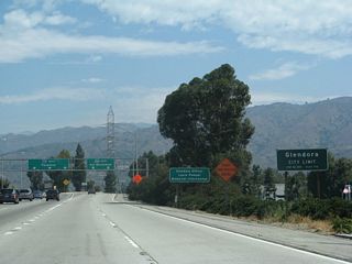 California 57 departs San Dimas and enters the city of Glendora just as the freeway approaches its northern terminus with California 210.