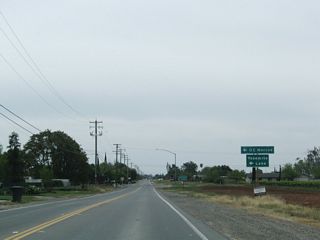 Southbound California 59 approaches Bellevue Road, which travels west to Franklin Road and east to Lake Yosemite County Park and the University of California at Merced (UC Merced). This campus is a relative newcomer to the the University of California network, having opened to students on September 5, 2005, after over 15 years of advance planning for the arrival of the tenth campus in the University of California system.