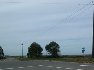 A Merced County J-17 shield is posted just west of California 59.