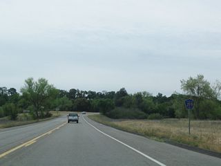 A CR J-59 reassurance shield is posted after the California 132 intersection.