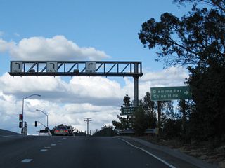 Now on the off-ramp to Grand Avenue, turn right for the connection to Diamond Bar and Chino Hills.