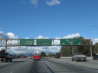 Eastbound California 60 and northbound California 57 split at Exit 25. Use the right three lanes to exit onto California 57 (Orange Freeway) north (Exit 25); the left four lanes continue east along California 60 (Pomona Freeway). The next exit along California 60 east is Exit 26, Diamond Bar Boulevard.