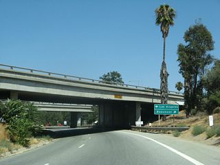 Traffic from Interstate 10 (former U.S. 70-99) merges with traffic from SR 60 (former U.S. 60) ahead of W 6th Street in Beaumont. The three historic routes combine again for the first time since Pomona near Kellogg Hill.