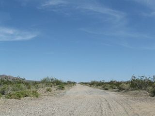 The original alignment of old U.S. 60/70 along Box Canyon Road extended east from Cottonwood Springs Road to Pinto Road. This abandoned section of roadway likes southeast of the Cottonwood Springs Interchange along Interstate 10.