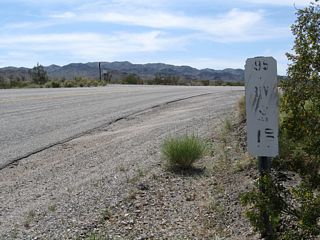 A remnant postmile marker for former California 195 is posted along Historic U.S. 60-70 where Cottonwood Springs Road south transitions onto Box Canyon Road west.