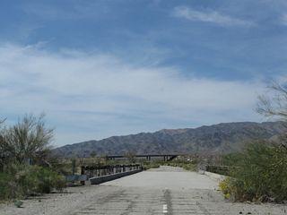 The last in a series of bridges spanning washes along Pinto Road lies midway between Big Canyon Road and Cottonwood Springs Road.