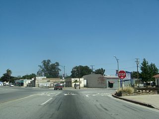 Eastbound Sixth Street (old U.S. 60-70-99) meets California Avenue and Grace Avenue at this five-way intersection. Sixth Street curves from southeast to east at this point.