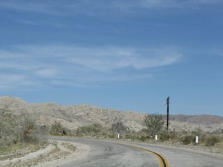 Box Canyon Road navigates through an S-curve ahead of Painted Canyon Road.