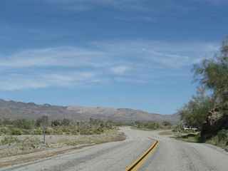 Leaving Box Canyon, Historic U.S. 60-70 enters Shavers Valley. The Cottonwood Mountains, which separate the Colorado Desert from the Mojave Desert, rise to the north.