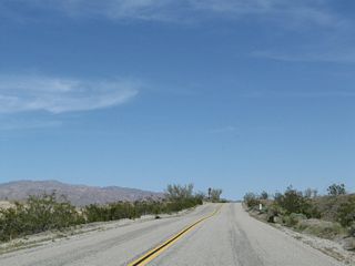 Modern road construction would demand the road be flattened and straightened through an area like this, but road construction practices of the 1930s left roads undulating with the existing landscape.