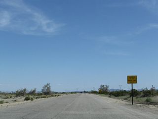 The old alignment of U.S. 60/70 on Chuckwalla Road initially travels southeast from Interstate 10 by Exit 201.