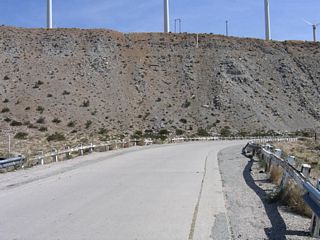 The shoulder of this old road was widened a bit with concrete and again with asphalt. At one time, this road was striped.