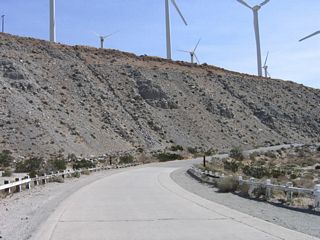 After making the banked turn to the south, the old road reverts from concrete to asphalt.