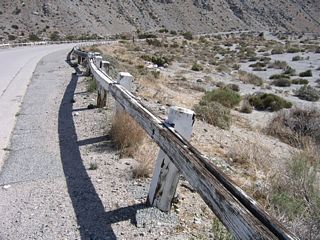 The fence guardrail has certainly seen some better days, especially considering the baking sun in the desert. However, it is still used today, and it is in fairly decent condition considering the age of the road and bridge.
