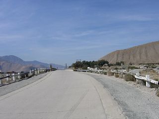 U.S. 60-70-99 westbound just ahead of the Whitewater River bridge. The concrete road leading to the bridge was also built with the bridge in 1925.