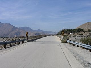 The bridge railings and supports are all made of concrete, just like the bridge deck.