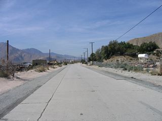 Beyond the Whitewater River bridge, Whitewater Cutoff Road (old U.S. 60-70-99) continues west past the Whitewater Rock & Supply Company.