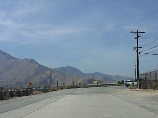 Originally, the concrete road continued straight onto the right-of-way for Interstate 10 west to Whitewater. It was realigned in the early 1950s when the new U.S. 60-70-99 expressway was built.