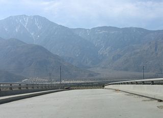 The entrance ramp for eastbound Interstate 10 to Indio, Blythe, and Phoenix, Arizona follows at the succeeding right-turn.