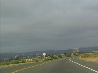 Across San Leandro Bay, the Oakland/Alameda County Coliseum Complex (Network Associates Coliseum) are visible across the water; this facility is located next to Interstate 880, which gives a good idea of the distance from here to the arena. The Oakland Raiders, Oakland A', and Golden State Warriors play their respective professional sports (National Football League, Major League Baseball, and National Basketball Association) in the stadium/arena complex.