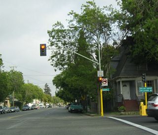 California 61 south turns right from Encinal Avenue onto Broadway.
