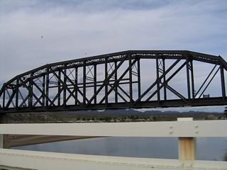 The BNSF Railroad bridge parallels the Colorado River Bridge linking Arizona State Route 95 Alternate and California State Route 62 to the north.