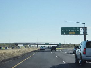 Southbound California 65 reaches Exit 313, Twelve Bridges Drive.