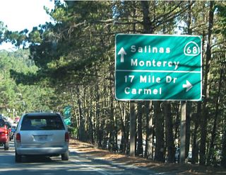 As eastbound California 68 (W.R. Holman Highway) winds its way through the Del Monte Forest, it approaches a turnoff to California 1 and the 17-Mile Drive. The 17-Mile Drive heads west and north past Pebble Beach and Spanish Bay to rejoin California 68 in Pacific Grove.