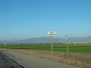 The California 68 freeway ends as it approaches the urban limits of Salinas.