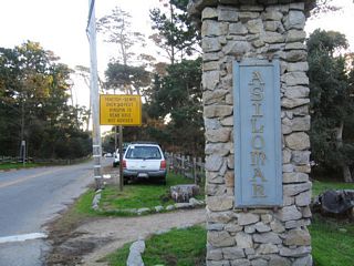 A stone pillar with the word "Asilomar" is located on either side of the entrance to the conference grounds. A Caltrans-installed sign advises against trucks using this section of California 68 as it takes over southbound Asilomar Avenue straight ahead.