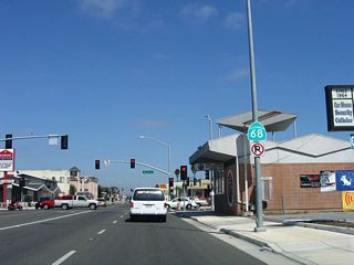 After turning off Main Street onto westbound John Street, this California 68 east reassurance shield is posted prior to the Pajaro Street intersection.