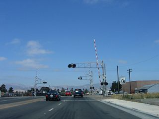Shortly thereafter, eastbound California 68 (John Street) crosses the Union Pacific Railroad tracks.