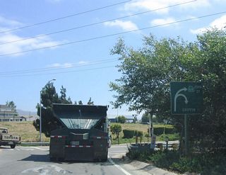 California 68 begins at Exit 327 (John Street interchange) from U.S. 101 (El Camino Real). Upon exiting southbound U.S. 101 at Exit 327, this sign is the first to advise of California 68 turning right (west) onto John Street into the city of Salinas, the seat of Monterey County and home of the John Steinbeck Center. Incorporated in 1872, Salinas is the largest city in Salinas Valley, which is known as "The Salad Bowl of the World" due to the presence of farms and ranches throughout the area. As of the 2000 Census, 143,920 people lived in Salinas.