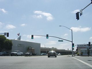 Westbound California 68 (John Street) meets U.S. 101 Business (Front Street) north and U.S. 101 Business (Abbott Street) south at this traffic signal. The business route follows an old alignment of U.S. 101. Follow U.S. 101 Business (Front Street) north to Market Street and a junction with California 183 northwest to California 1 and Castroville. To the south, U.S. 101 Business (Abbott Street) eventually reunites with U.S. 101 (El Camino Real) southeast of town.