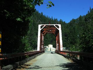 The one-lane, through-truss bridge spanning the North Fork of the Feather River was built in 1912.