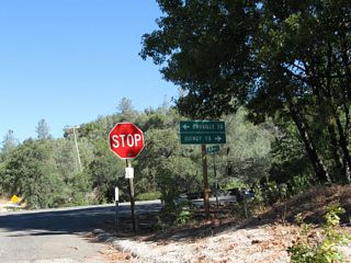 Big Bend Road, the connecting road from Dark Canyon Road to the modern Feather River Highway, meets California 70 (Feather River Highway) at this intersection. Turn left for Oroville (20 miles) or right for Quincy (58 miles).
