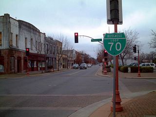 Traveling west along Montgomery Street through Downtown Oroville, this shield assembly mistakenly showed California 70 Business as Business Loop I-70. According to Warren Jensen on 12/17/03, &quot;the famous I-70 business shield in downtown Oroville was vandalized this year and the shield had to be replaced.  Did they make a correct California 70 Business shield?  Nope. They ordered a brand new I-70 business shield!&quot;