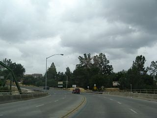 On this rainy day, California 70 Business (Table Mountain Boulevard) crosses over the Feather River. The business route will proceed north until reaching Nelson Avenue, where it will turn west to return to the freeway. An old alignment of California 24 and U.S. 40 Alternate will follow Table Mountain Boulevard north, only to merge with California 70 at the California 191 intersection.