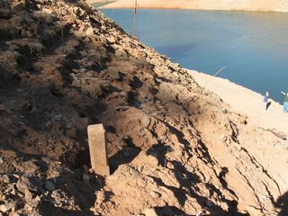 The extant segment of Dark Canyon Road comes to a dead at the water's edge. Remnant features of the old road include pavement, rock walls, and C monuments that mark the old highway's right of way. The water level of Lake Oroville varies, so some areas may be alternate between being exposed or submerged depending upon long term weather patterns.