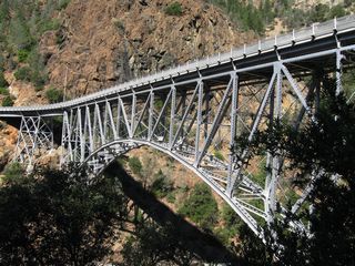 The Pulga Bridge carries California 70 over the West Branch of the Feather River near the Pulga Road intersection. This bridge was built in 1932 and is a deck arch bridge.