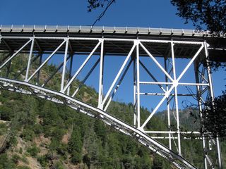 The substructure of the Pulga Bridge is only fleetingly visible from California 70's travel lanes. A railroad bridge also crosses the river at this point.
