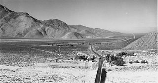 Looking west at what was U.S. 60/70 along Whitewater Cutoff Road. The bridge spanning the Whitewater River along the alignment predating 1952 appears in the foreground.